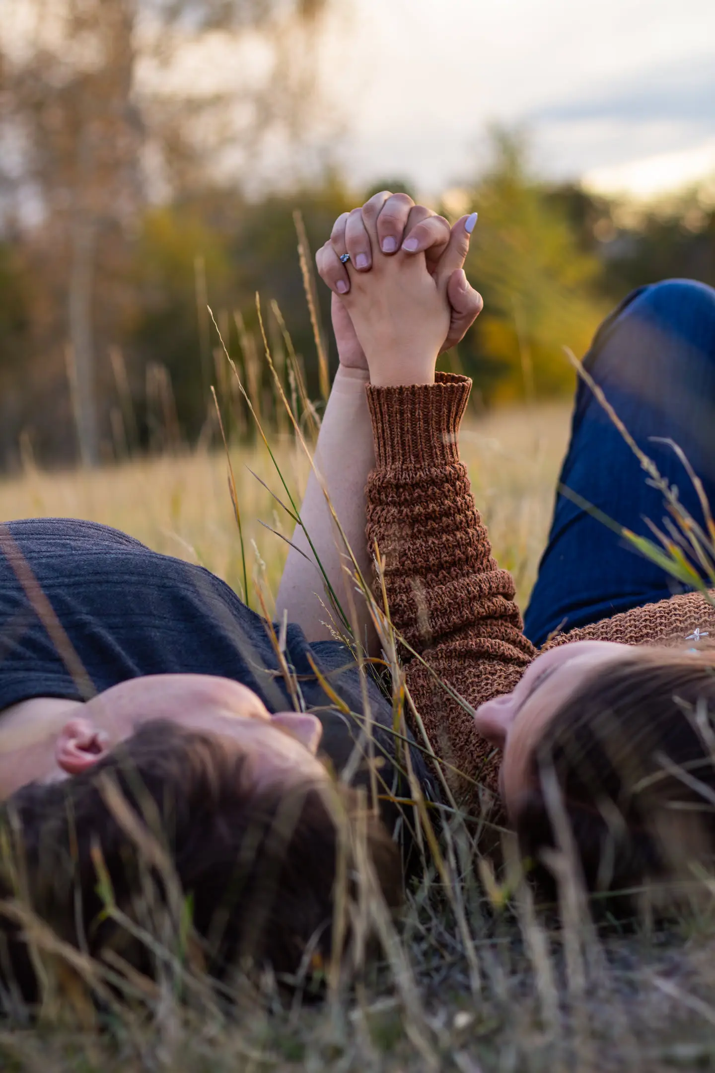 the couple engagement hand hold